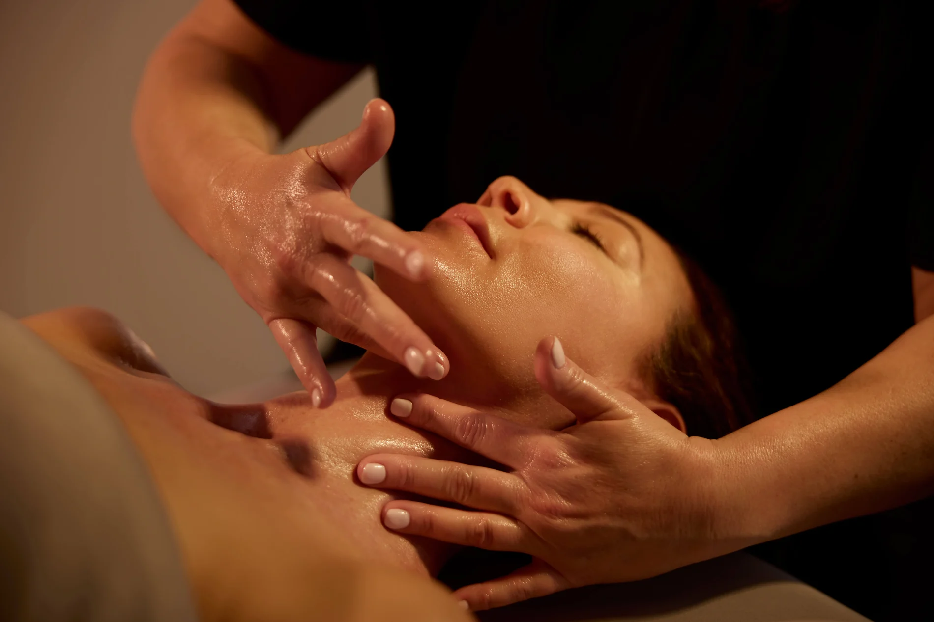 Woman getting facial at Woodhouse Spa