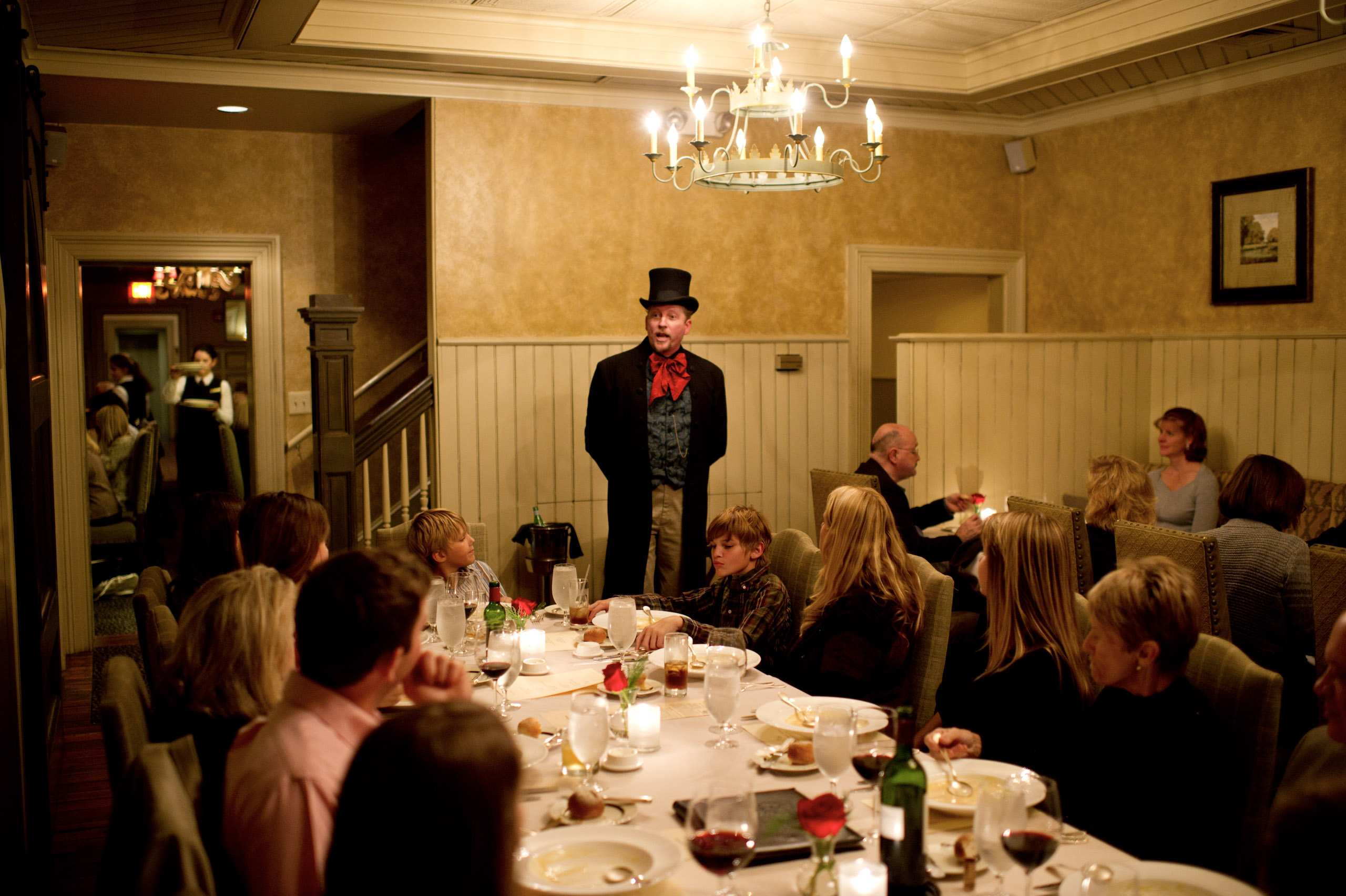 man entertaining a room full of diners