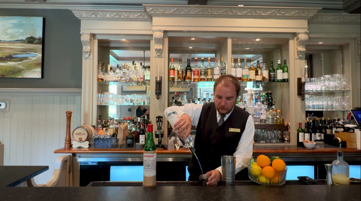 Denis behind the bar